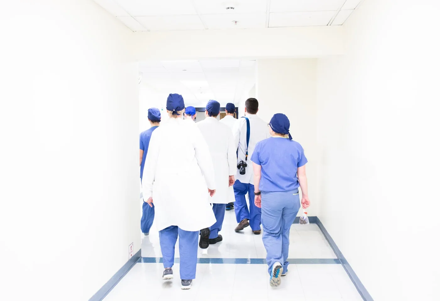 Healthcare team walking through a hospital corridor
